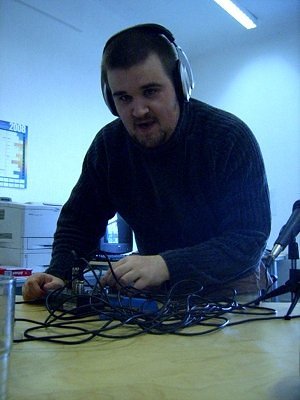 Mark with his podcasting equipment